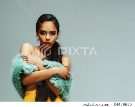 young pretty african-american woman posing in fashion clothers emotional, lifestyle people concept 84459690