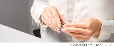 Professional manicurist preparing tools for doing clients nails. Professional manicurist preparing tools for doing clients nails. 84460725