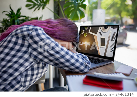 Cropped shot view of young woman working on laptop computer while sitting in modern cafe bar interior. Design. Web design Cropped shot view of young woman working on laptop computer while sitting in modern cafe bar interior. Design. Web design 84461314