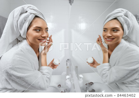 Stylish woman getting ready for sleep. 84463402