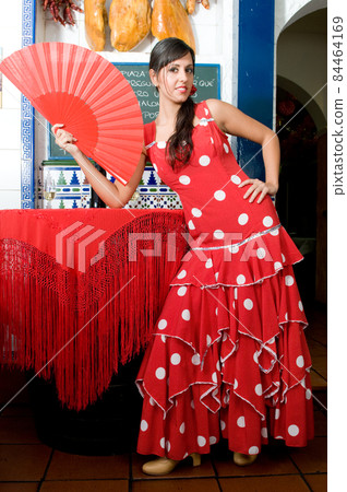 tipical spanish dancers with flamenco dresses in a bar tipical spanish dancers with flamenco dresses in a bar 84464169