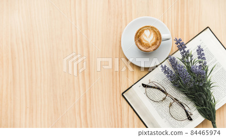 overhead view coffee latte lavender flower spectacles notebook wooden background. High quality photo overhead view coffee latte lavender flower spectacles notebook wooden background. High quality photo 84465974