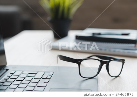 office desktop with laptop analytics. High quality photo 84465975