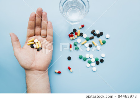 top view hand holding pills. High quality photo 84465978