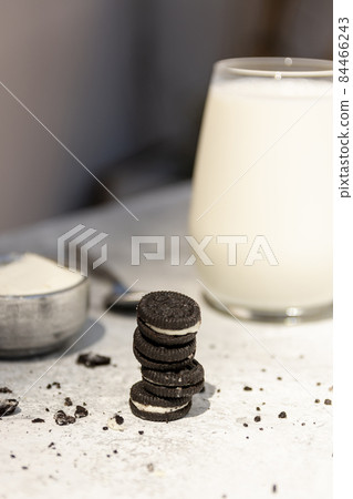 arrangement with tasty oreo glass milk. High quality photo arrangement with tasty oreo glass milk. High quality photo 84466243