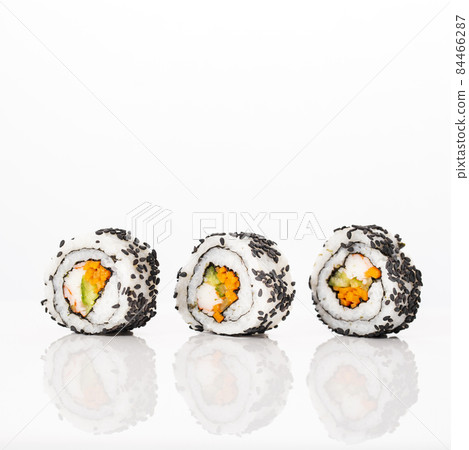 front view maki sushi rolls with sesame seeds. High quality photo 84466287