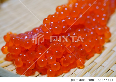 Raw salmon roe on a bamboo basket, fresh sujiko Raw salmon roe on a bamboo basket, fresh sujiko 84466543