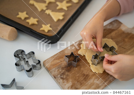 Children's hands making cookies Children's hands making cookies 84467161