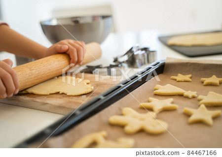Children's hands making cookies Children's hands making cookies 84467166