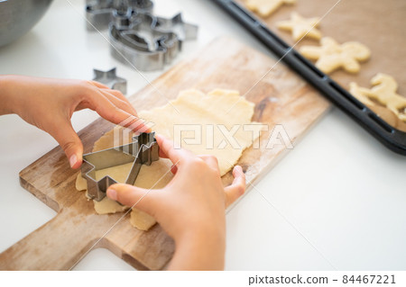 Children's hands making cookies 84467221
