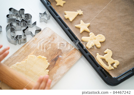 Children's hands making cookies 84467242