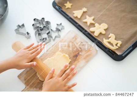 Children's hands making cookies Children's hands making cookies 84467247