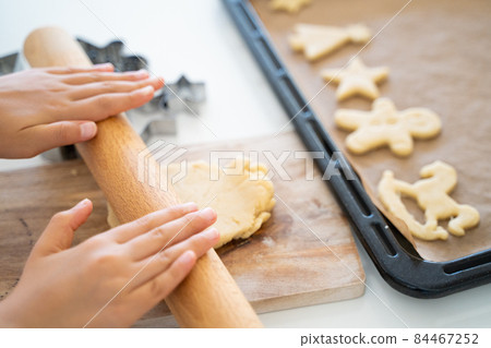 Children's hands making cookies Children's hands making cookies 84467252