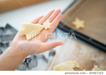 Children's hands making cookies Children's hands making cookies 84467283