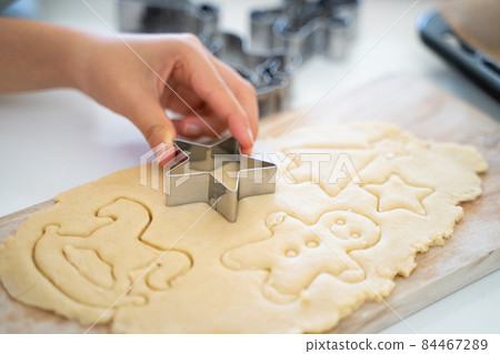 Children's hands making cookies Children's hands making cookies 84467289