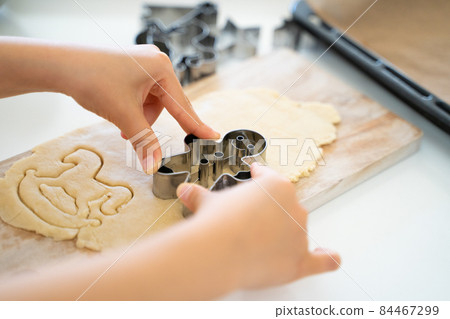Children's hands making cookies 84467299
