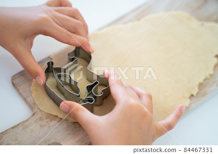 Children's hands making cookies Children's hands making cookies 84467331