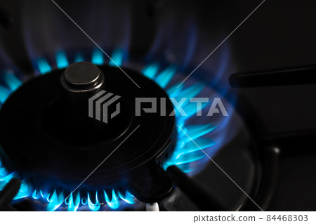 Flame of the gas stove in the ignited kitchen Close-up from diagonally above Flame of the gas stove in the ignited kitchen Close-up from diagonally above 84468303