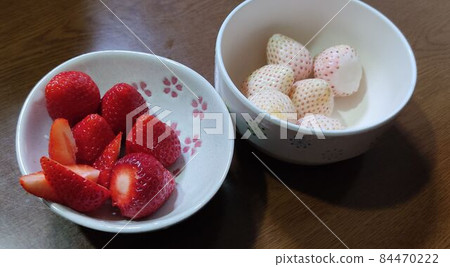 Red strawberry and white strawberry 84470222