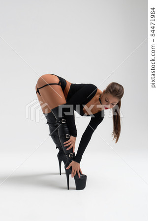 Slim woman in sexy lingerie and boots 84471984