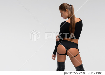 Slim woman in sexy lingerie and boots 84471985