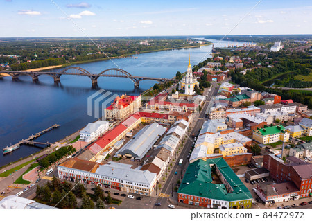 Aerial view of Rybinsk with Transfiguration Cathedral on bank of Volga and bridge 84472972