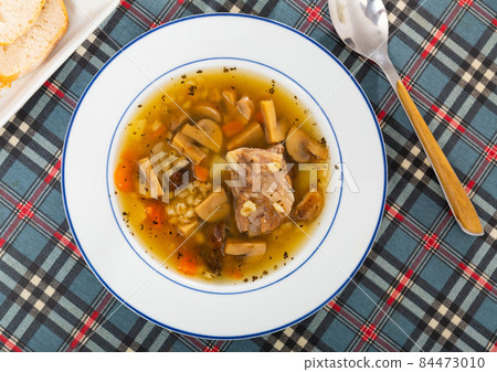 Top view of mushroom soup in bowl on table Top view of mushroom soup in bowl on table 84473010