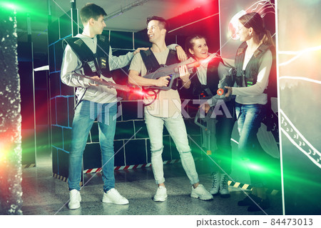 Triumphing team of laser tag winners guys and girls Triumphing team of laser tag winners guys and girls 84473013