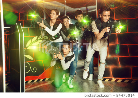 Friends having fun on lasertag arena 84473014