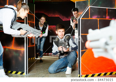 Teenager boy having fun on lasertag arena Teenager boy having fun on lasertag arena 84473015
