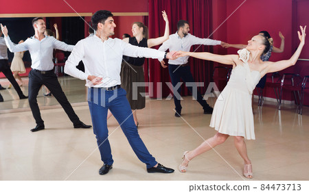People learning to dance waltz in dancing class People learning to dance waltz in dancing class 84473713