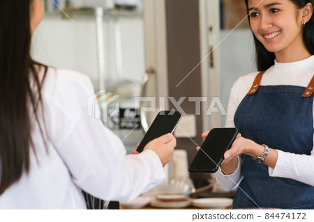Customer making payment using NFS technology 84474172