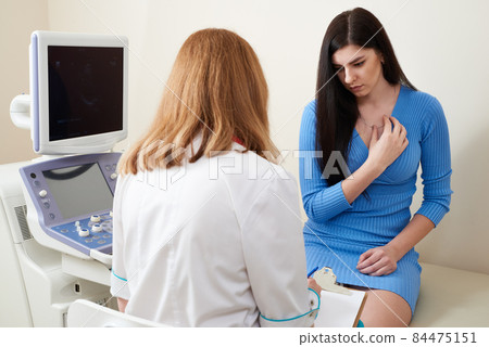 Gynecologist consulting young woman at ultrasound scanning office 84475151