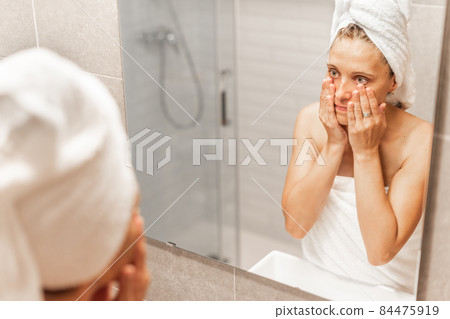 Woman worrying about the passage of time and wrinkles. Woman worrying about the passage of time and wrinkles. 84475919