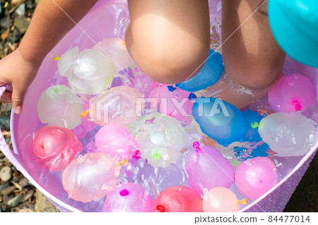A refreshing image with beautiful colorful and POP water balloons A refreshing image with beautiful colorful and POP water balloons 84477014