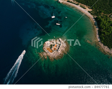 Boat trip to the island of Otocic Gospa. Montenegro. Drone 84477781