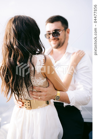 View of the bride and groom in sunglasses, Playful bride in sunglasses  sharing a tender moment with the groom on their wedding day. 39565353 Stock  Video at Vecteezy