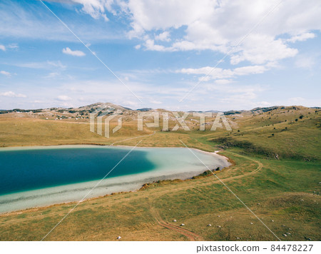 Lake Vrazje against the background of blue sky. Montenegro Lake Vrazje against the background of blue sky. Montenegro 84478227