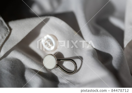 button extender shown on a white dress shirt to increase size button extender shown on a white dress shirt to increase size 84478712
