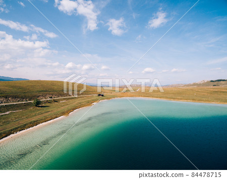 Clear water of Lake Vrazje against the blue sky. Montenegro Clear water of Lake Vrazje against the blue sky. Montenegro 84478715