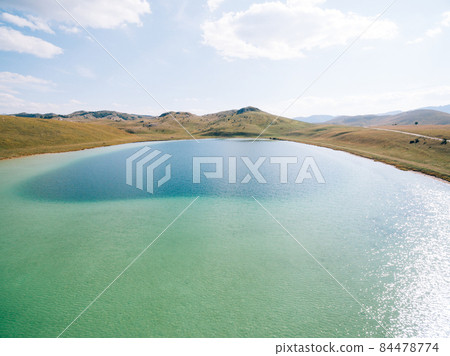 Clear water of Lake Vrazje against the background of mountains. Montenegro Clear water of Lake Vrazje against the background of mountains. Montenegro 84478774