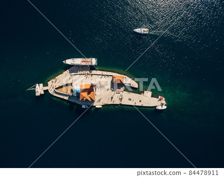 Aerial view of boats near the island of Gospa od Skrpjela. Montenegro Aerial view of boats near the island of Gospa od Skrpjela. Montenegro 84478911
