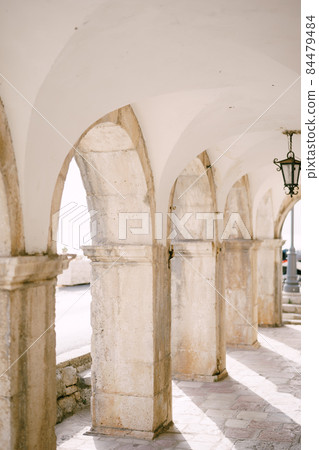 Wall with arches at the pier of Perast. Montenegro 84479484