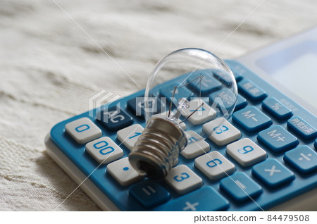 Light bulb and calculator (electricity bill, living expenses, image) 84479508