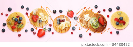 Concept of delicious dessert with pancakes on pink background Concept of delicious dessert with pancakes on pink background 84480452