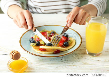 Concept of delicious dessert with pancakes on white wooden table 84480462