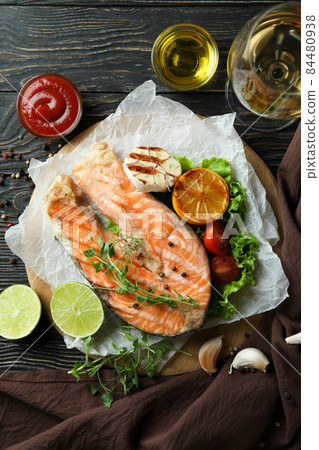 Concept of tasty eating with grilled salmon, top view 84480938