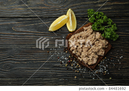 Sandwich with canned tuna on wooden background Sandwich with canned tuna on wooden background 84481692