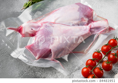 Vacuum packed turkey meat, on gray stone table background 84481951