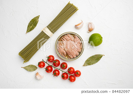 Pasta with tuna raw ingredients, on white stone table background, top view flat lay 84482097